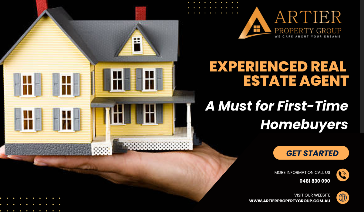 A hand holding a model of a yellow house with gray shutters, promoting experienced real estate agent services for first-time homebuyers by Artier Property Group